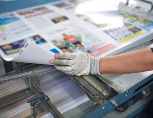 printing employee preparing direct mail