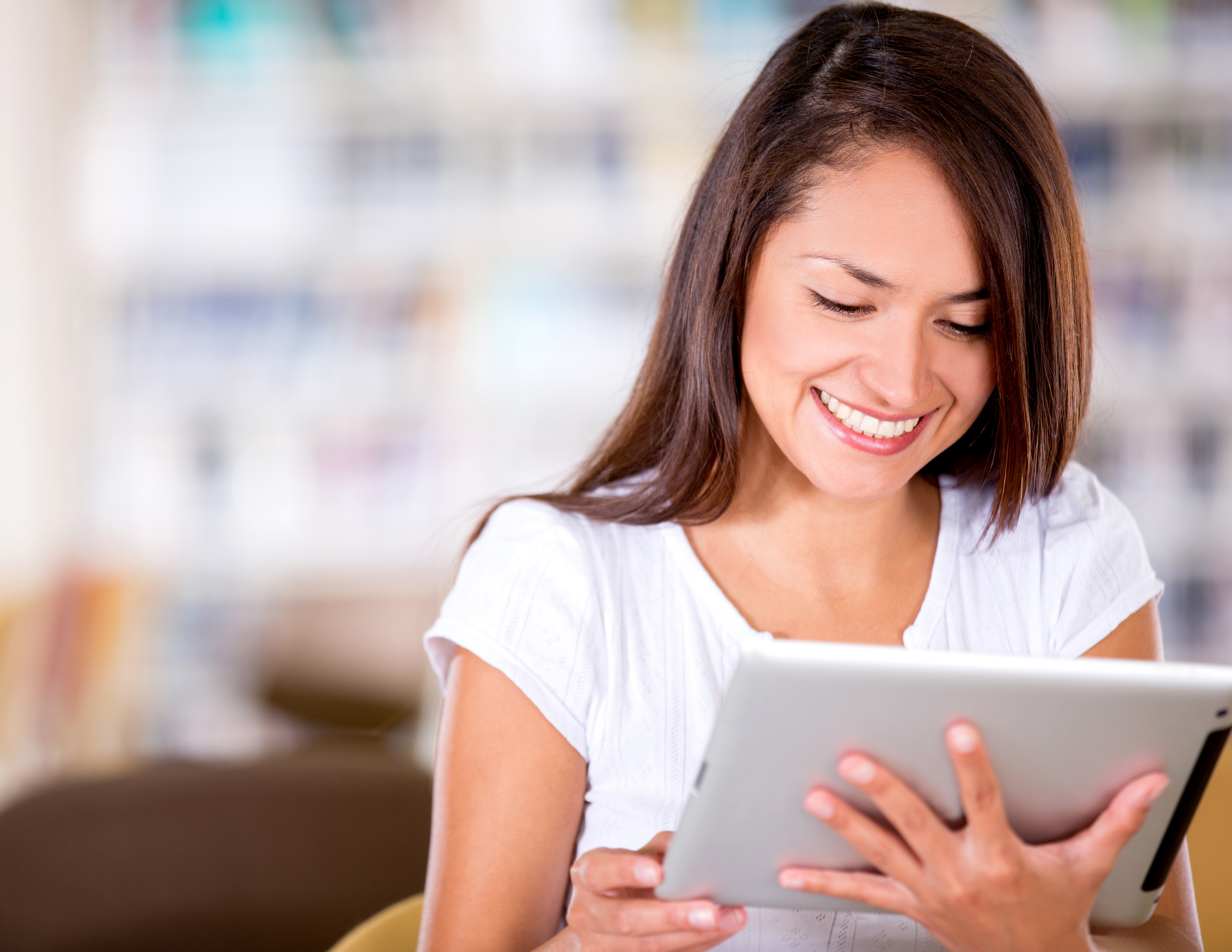 woman looking at tablet for direct mail statistics